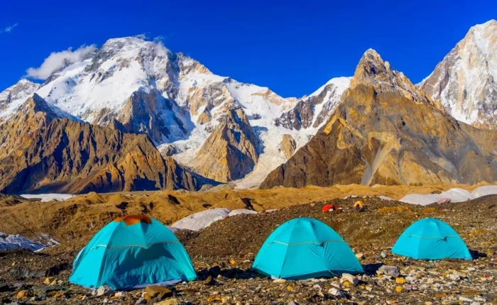 Blue tents at Concordia Camp with Broad Peak Expedition and K2 in the background