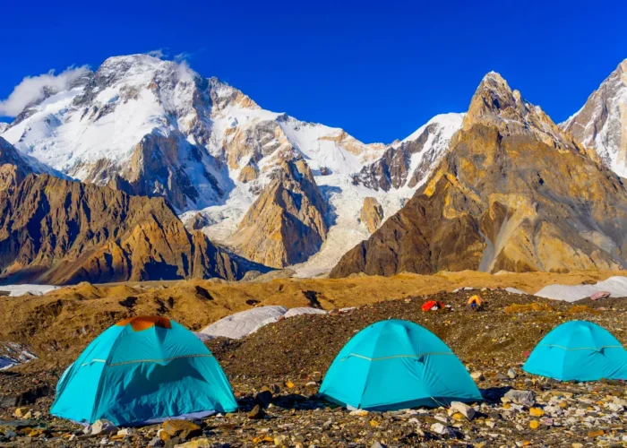 Blue tents at Concordia Camp with Broad Peak Expedition and K2 in the background