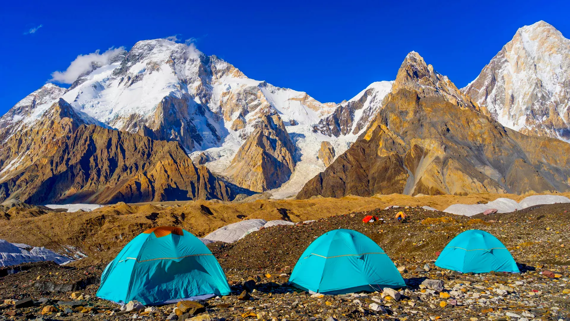 Blue tents at Concordia Camp with Broad Peak Expedition and K2 in the background