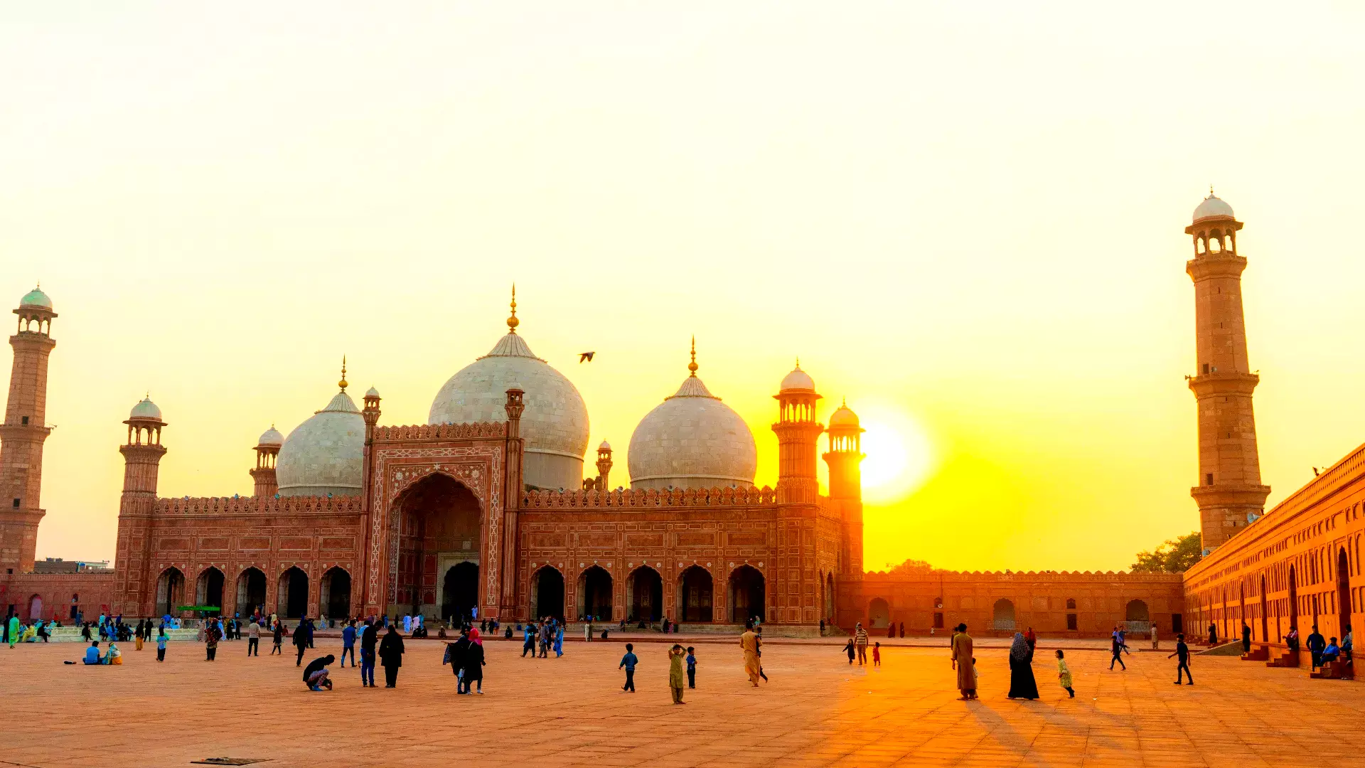 A bustling crowd near the Badshahi Mosque in Lahore.