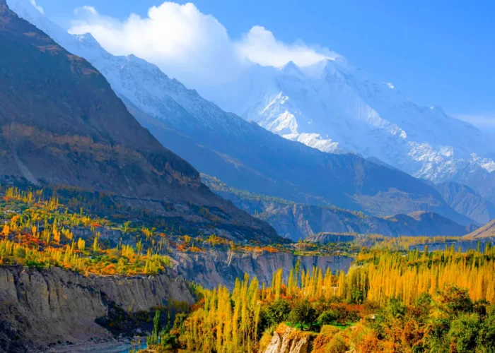 Scenic view of Hunza Valley in the Northern Areas of Pakistan, with majestic mountains and terraced fields.