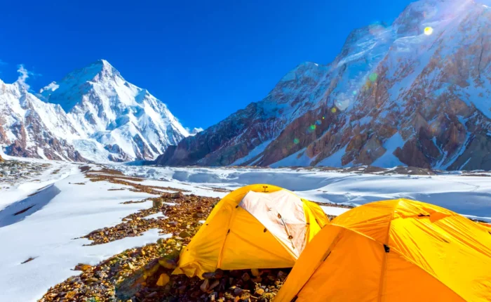 Group of trekkers hiking towards K2 Base Camp trek amid breathtaking mountain scenery