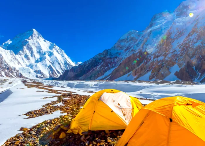 Group of trekkers hiking towards K2 Base Camp trek amid breathtaking mountain scenery