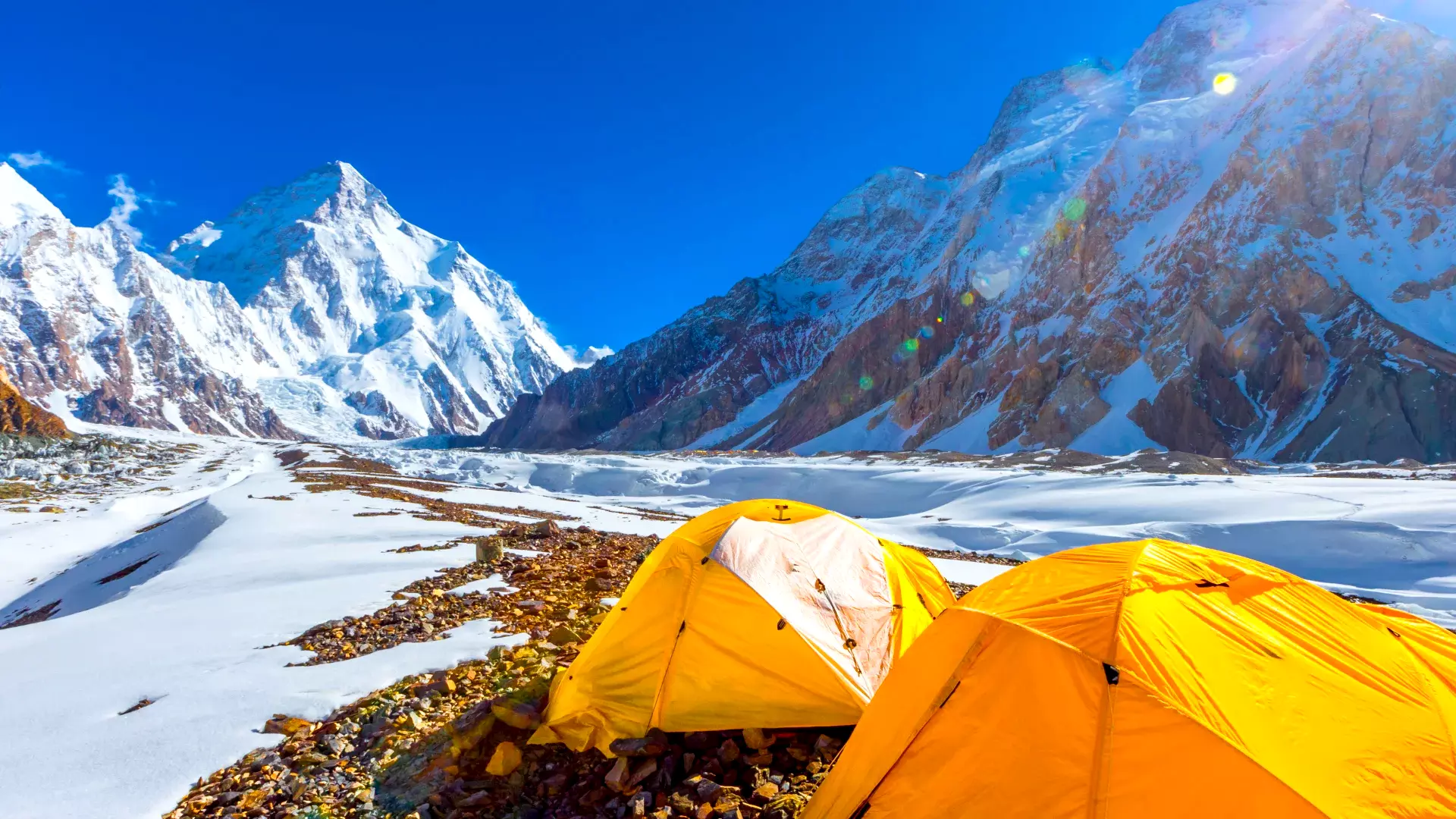 Group of trekkers hiking towards K2 Base Camp trek amid breathtaking mountain scenery