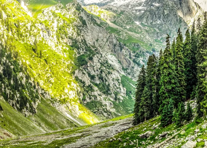 A breathtaking view of Kumrat Valley with majestic mountains in the background. 3 Days Tour to Kumrat Valley Adventure Book Now.