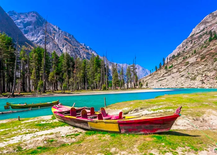 Majestic view of Mahodand Lake in Kalam, Swat Valley, Pakistan, surrounded by lush greenery and towering mountains.