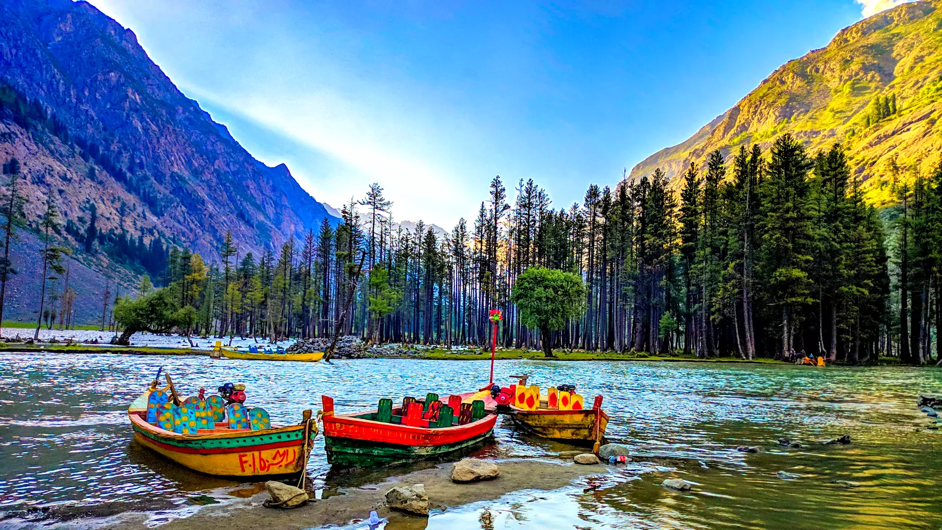 Panoramic view of boats floating on Mahodand Lake in Swat Valley, Pakistan.