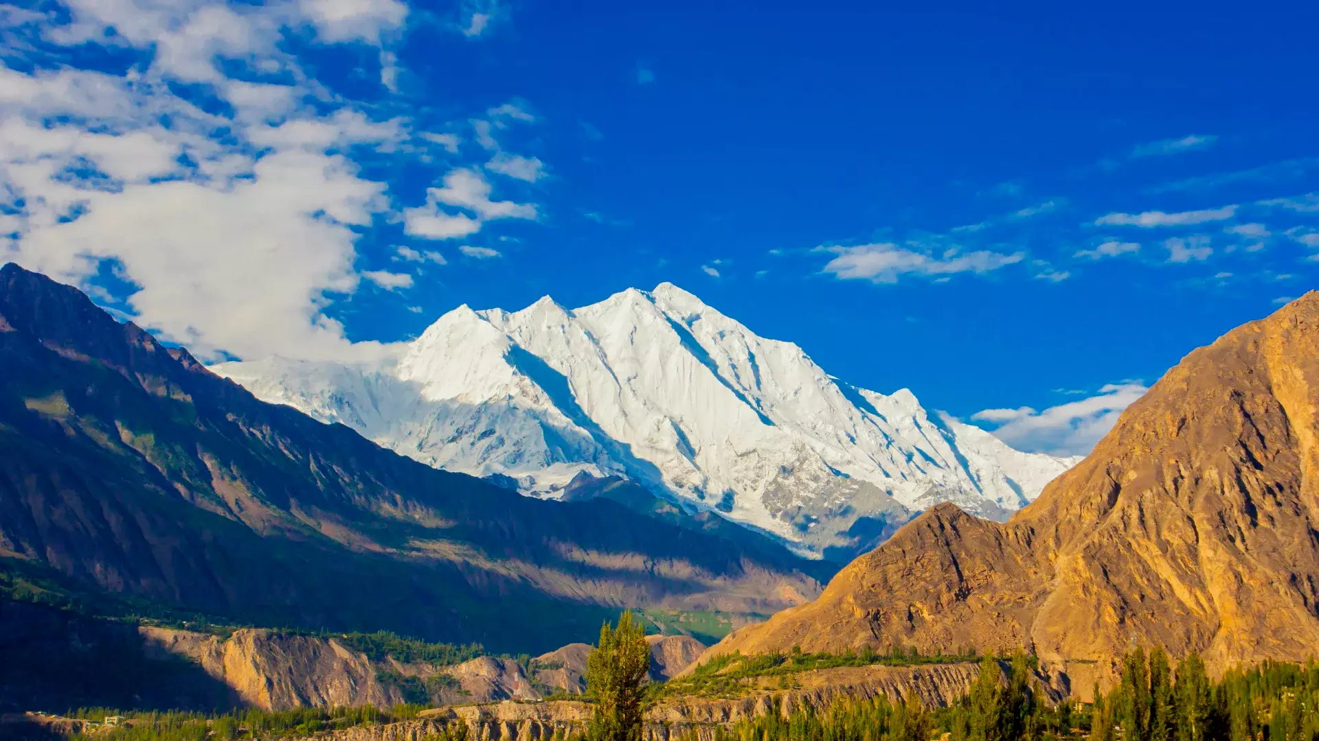 Majestic Rakaposhi peak towering over the surrounding landscape.