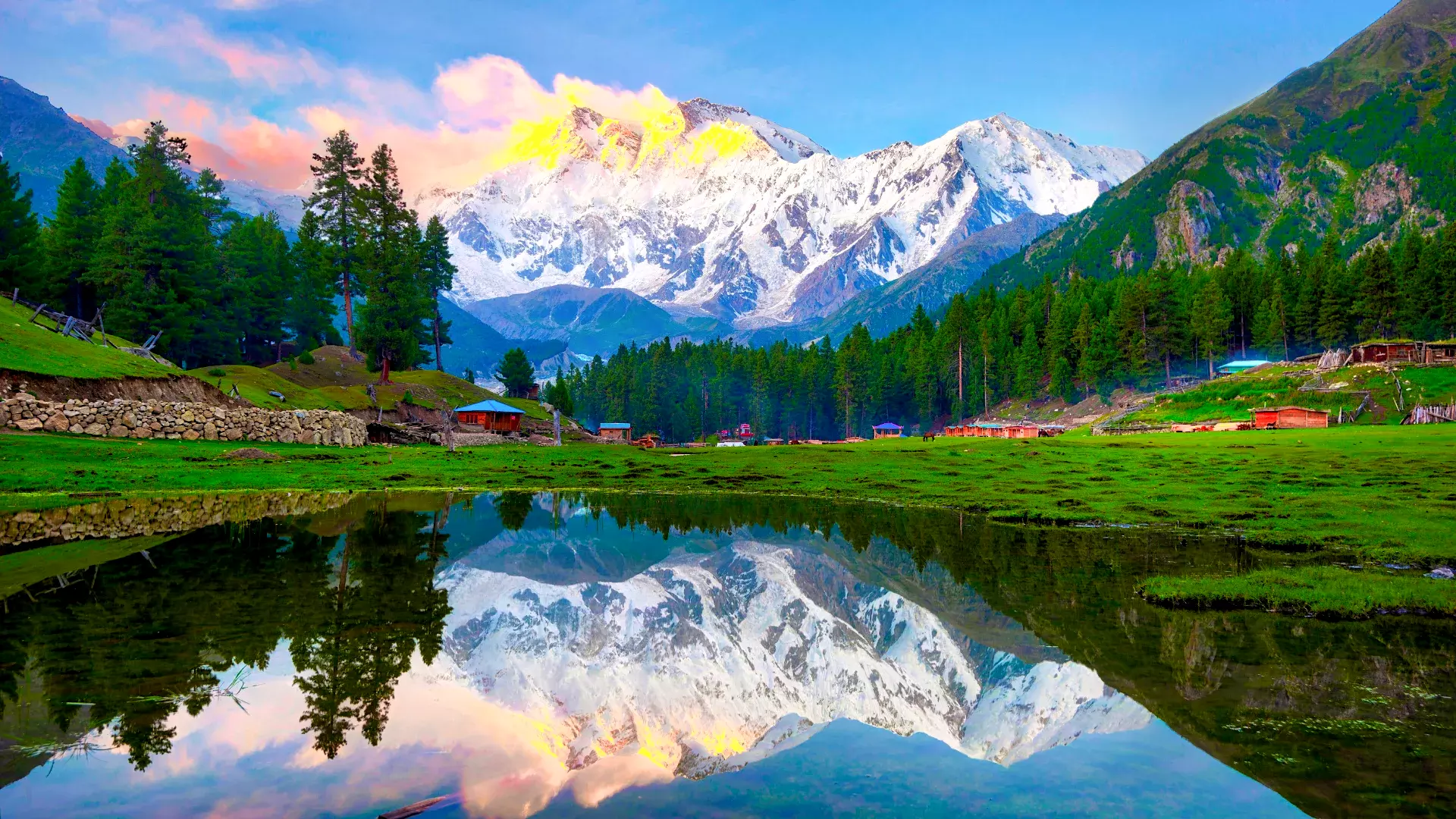 Reflection Pond at Fairy Meadows with Nanga Parbat in the background, Pakistan, showcasing clear water reflecting the towering snow-capped mountain and lush greenery.