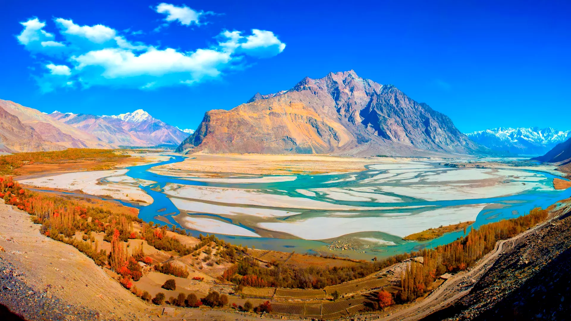 A picturesque view of rivers meeting along Shigar Valley Road.