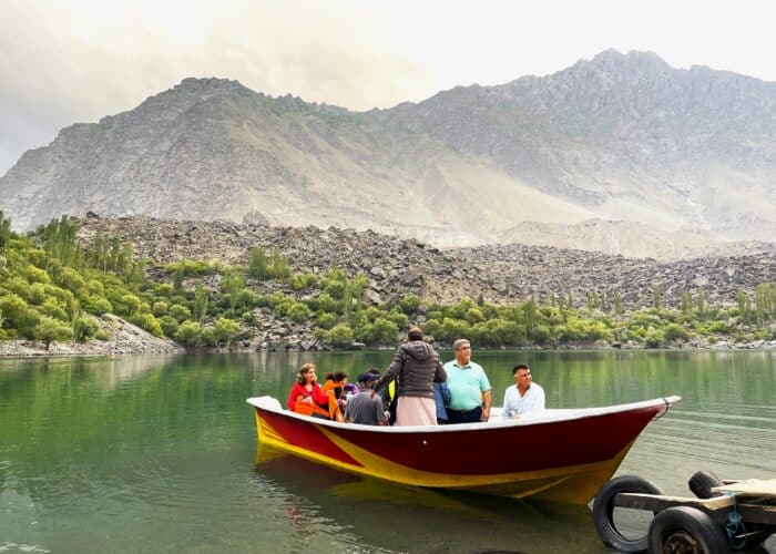 Tourists prepare to board a boat at Upper Kachura Lake in Skardu for a scenic ride